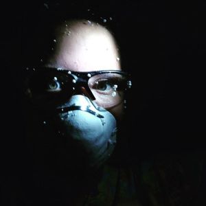 KellieAnn carves foam by flashlight while the power is out.